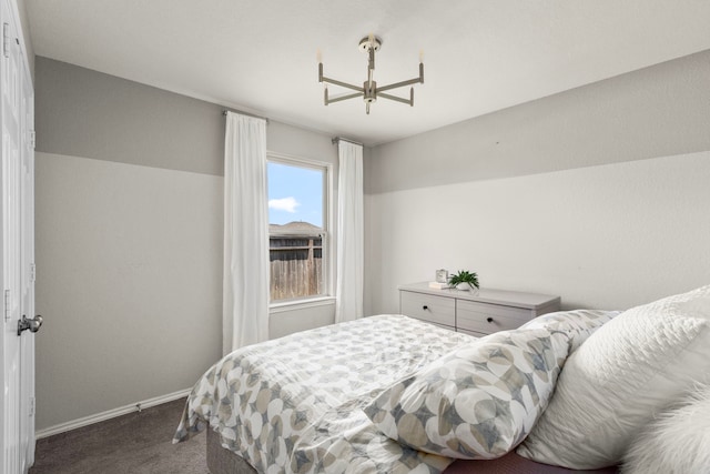 carpeted bedroom with baseboards