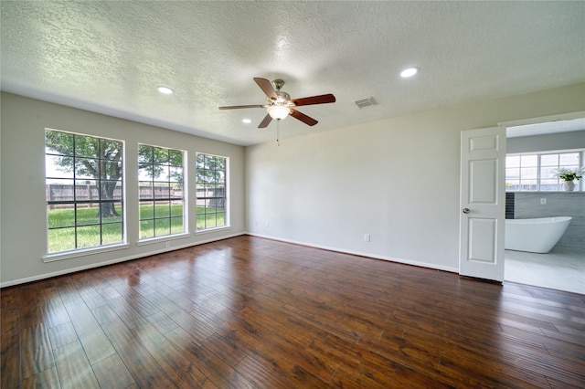 unfurnished room with a ceiling fan, recessed lighting, a textured ceiling, and dark wood finished floors