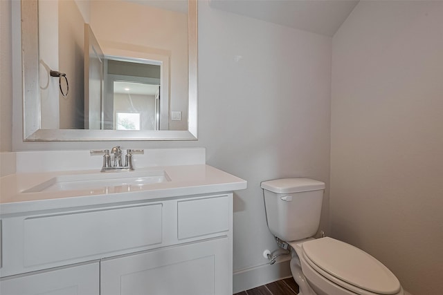half bath with vanity and toilet
