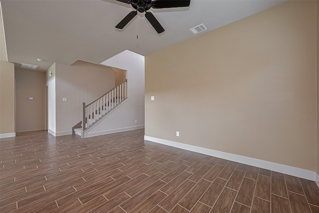 unfurnished room with dark wood finished floors, ceiling fan, baseboards, and visible vents