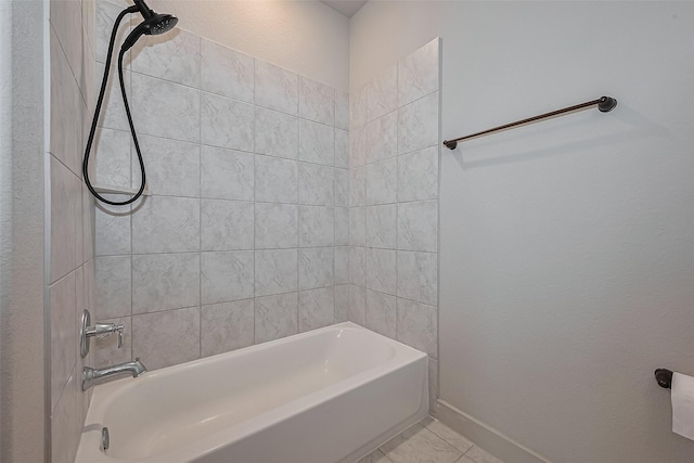 bathroom with baseboards, tile patterned flooring, and tub / shower combination