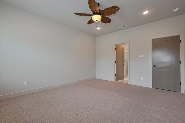 spare room featuring baseboards, visible vents, recessed lighting, light colored carpet, and ceiling fan