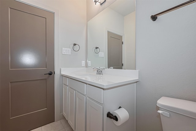 bathroom with toilet and vanity