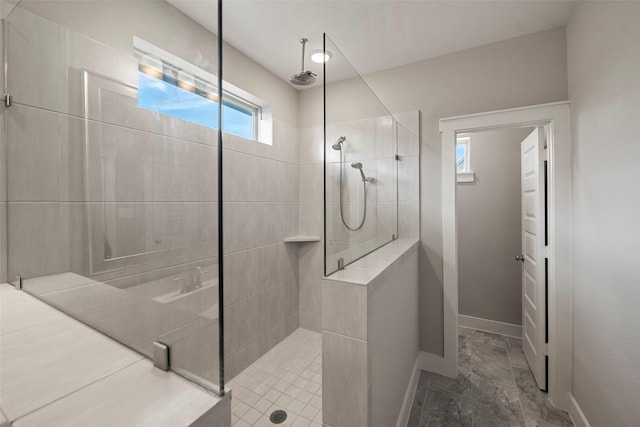 18611 Admiration Dr, Cypress, TX 77433 - bathroom featuring baseboards and a tile shower