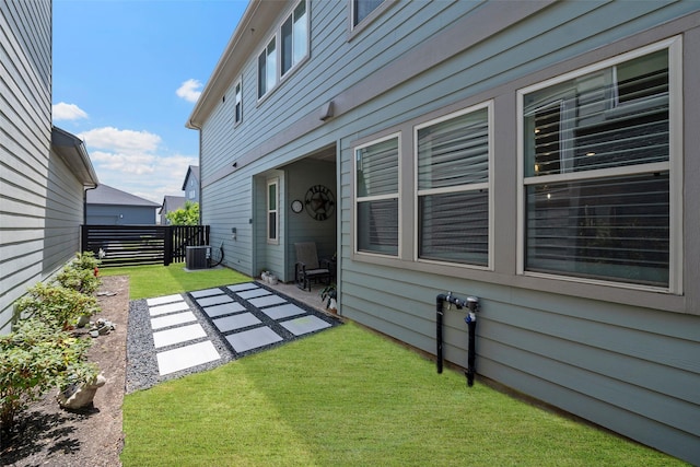 18611 Admiration Dr, Cypress, TX 77433 - back of property featuring a patio area, a lawn, central AC, and fence