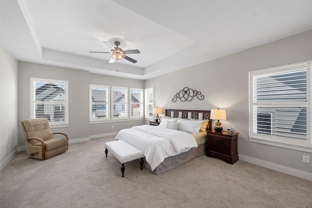 18611 Admiration Dr, Cypress, TX 77433 - carpeted bedroom with ceiling fan, baseboards, and a raised ceiling