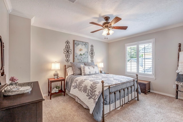 bedroom with crown molding, light carpet, a textured ceiling, and baseboards