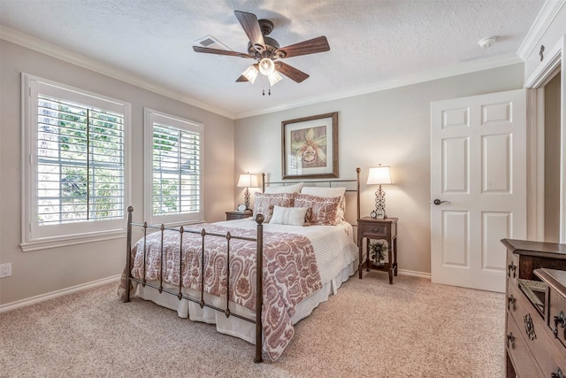 bedroom featuring a ceiling fan, crown molding, visible vents, baseboards, and light colored carpet