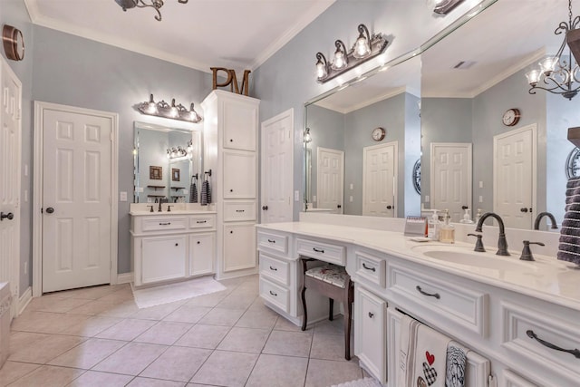 full bath featuring a sink, crown molding, two vanities, and tile patterned floors