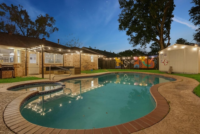 view of pool featuring a patio area, a shed, a fenced backyard, an outdoor structure, and a pool with connected hot tub