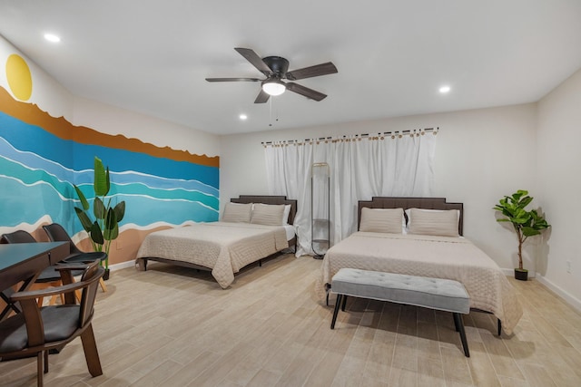 bedroom with recessed lighting, wood finished floors, a ceiling fan, and baseboards