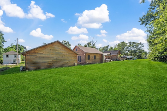 rear view of house featuring a yard