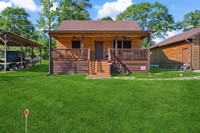 log-style house featuring a ceiling fan, log veneer siding, and a shingled roof