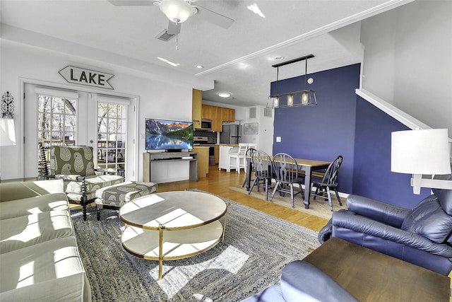 living area featuring recessed lighting, visible vents, french doors, light wood-style flooring, and ceiling fan