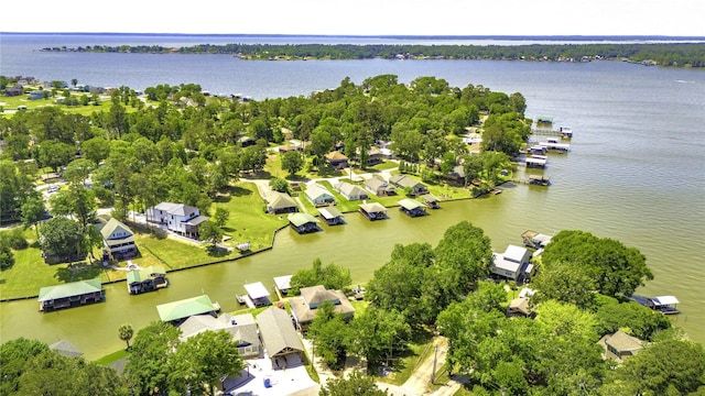 birds eye view of property featuring a residential view and a water view