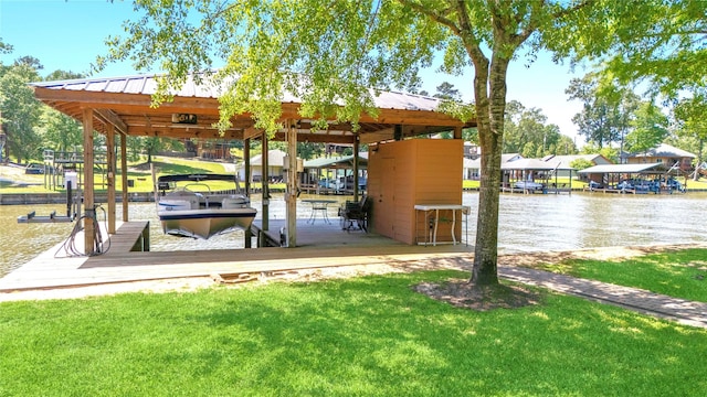 view of home's community featuring a water view, a lawn, a dock, and boat lift
