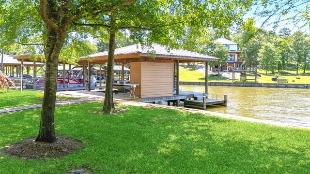 view of dock featuring boat lift, a yard, and a water view