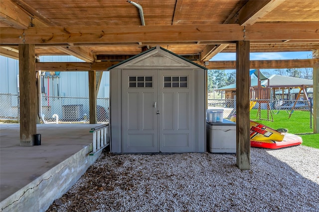 view of shed with fence