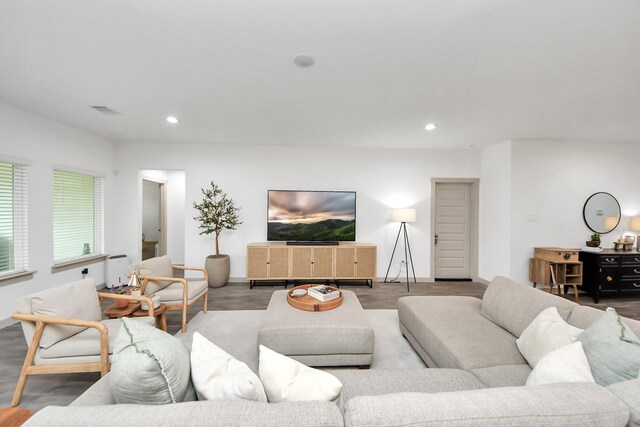 living area featuring recessed lighting and visible vents