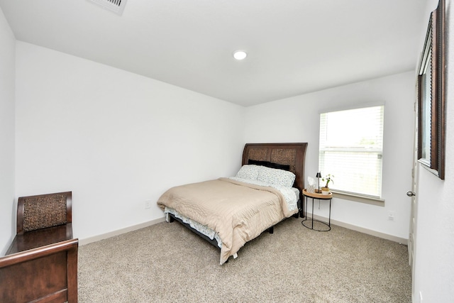 bedroom featuring carpet floors, baseboards, and visible vents