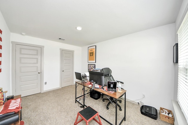 office space featuring visible vents and carpet
