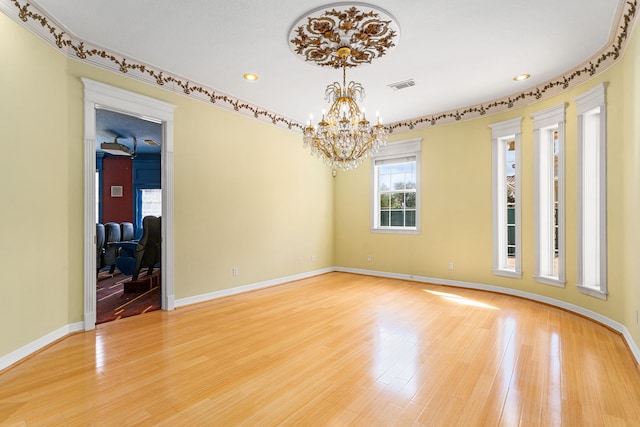 1002 Island Vw, League City, TX 77565 - spare room with a chandelier, light wood-style flooring, baseboards, visible vents, and recessed lighting