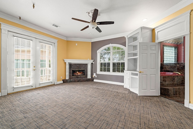 1002 Island Vw, League City, TX 77565 - unfurnished living room featuring ornamental molding, dark colored carpet, baseboards, and a ceiling fan