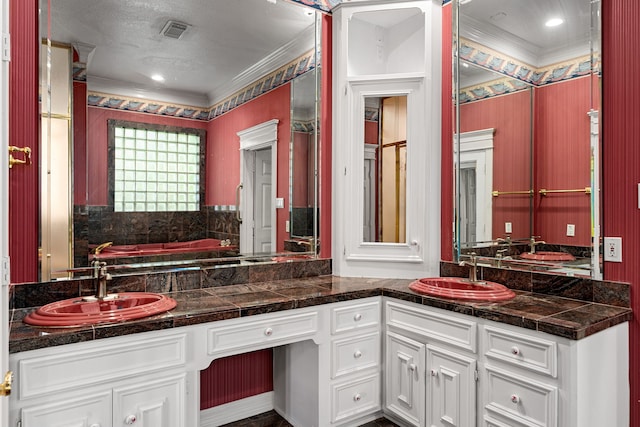 1002 Island Vw, League City, TX 77565 - bathroom with ornamental molding, a sink, visible vents, and double vanity