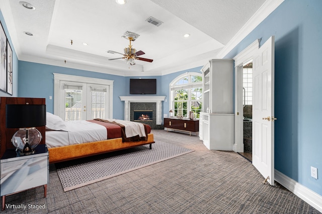 1002 Island Vw, League City, TX 77565 - bedroom with light carpet, visible vents, access to outside, and a raised ceiling