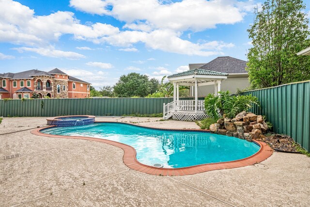 1002 Island Vw, League City, TX 77565 - view of swimming pool with a gazebo, a patio area, a pool with connected hot tub, and a fenced backyard