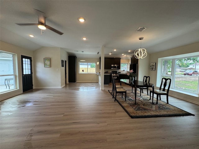 dining area featuring visible vents, light wood-type flooring, recessed lighting, and baseboards