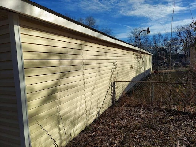 405 N Lanier St, New Boston, TX 75570 - view of home's exterior featuring fence