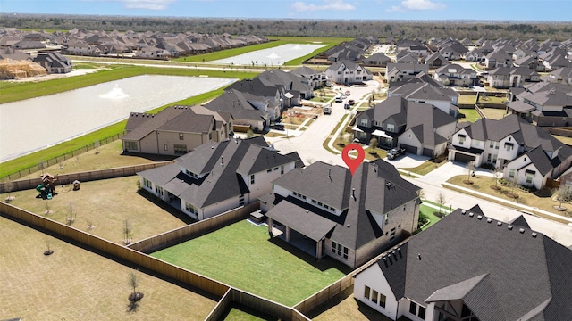 aerial view with a water view and a residential view