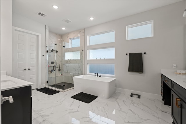 full bath with baseboards, visible vents, vanity, and a marble finish shower