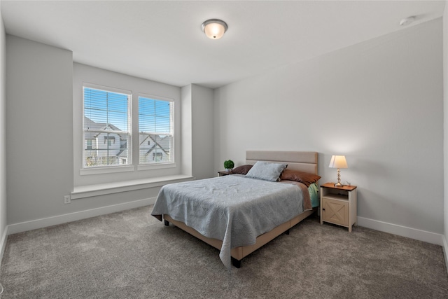 carpeted bedroom with baseboards