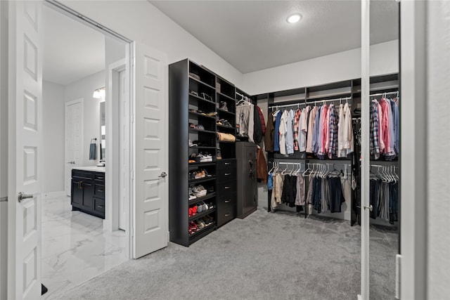 spacious closet with marble finish floor