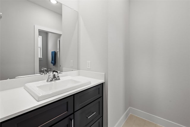 bathroom featuring recessed lighting, baseboards, tile patterned floors, and vanity
