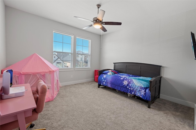 bedroom featuring baseboards, a ceiling fan, and carpet flooring
