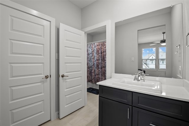 full bath featuring a ceiling fan and vanity