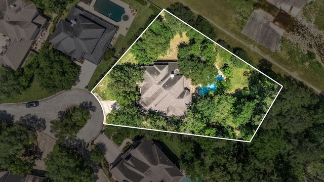 aerial view of property and surrounding area featuring property parcel outlined