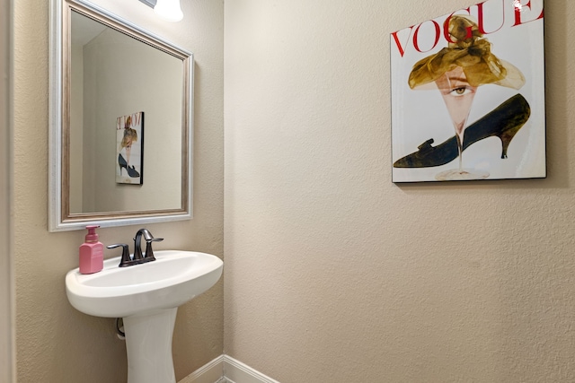 bathroom featuring baseboards