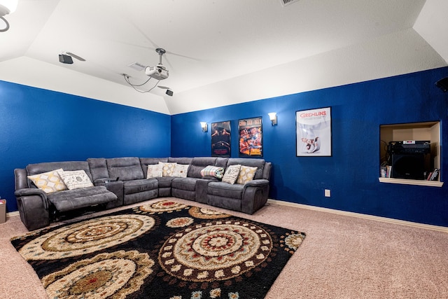 living area with vaulted ceiling, carpet flooring, and baseboards