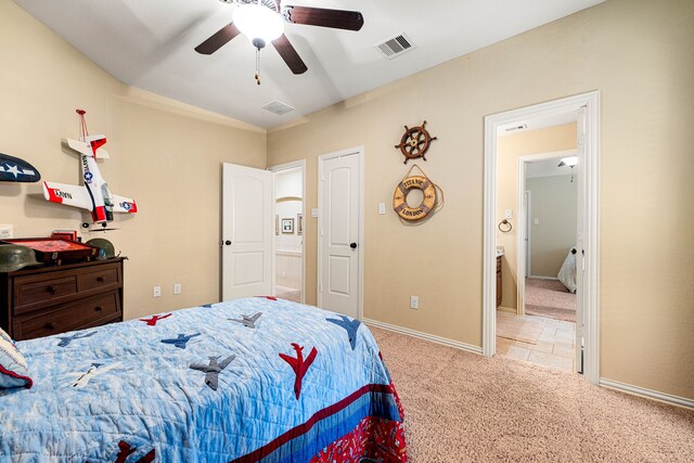 carpeted bedroom with baseboards, a ceiling fan, and visible vents