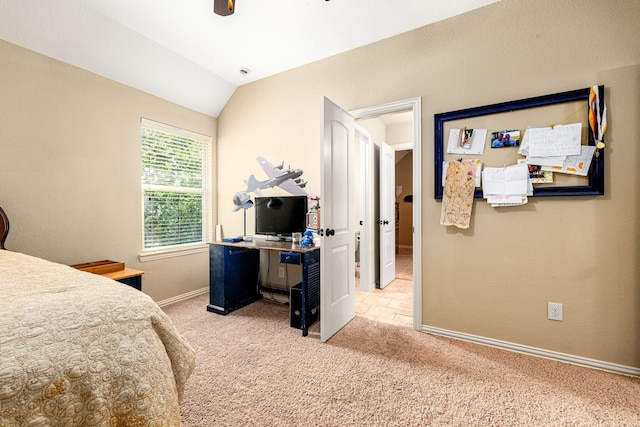 bedroom featuring lofted ceiling, light carpet, a ceiling fan, and baseboards