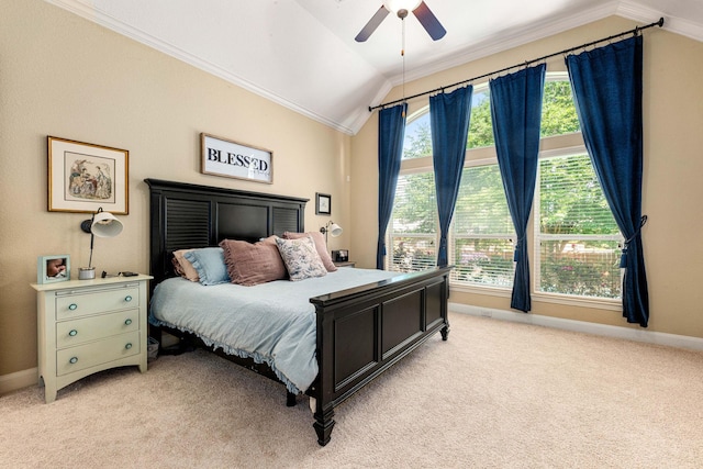 bedroom featuring lofted ceiling, light carpet, ornamental molding, baseboards, and ceiling fan