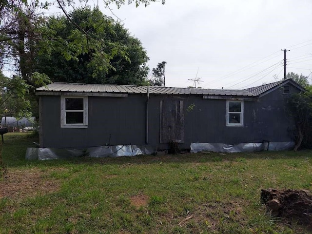 108 E Mcgee Rd, New Boston, TX 75570 - back of property with a yard and metal roof