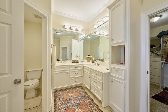 102 Capetown Slip, Conroe, TX 77356 - full bathroom with crown molding, double vanity, toilet, and tile patterned flooring