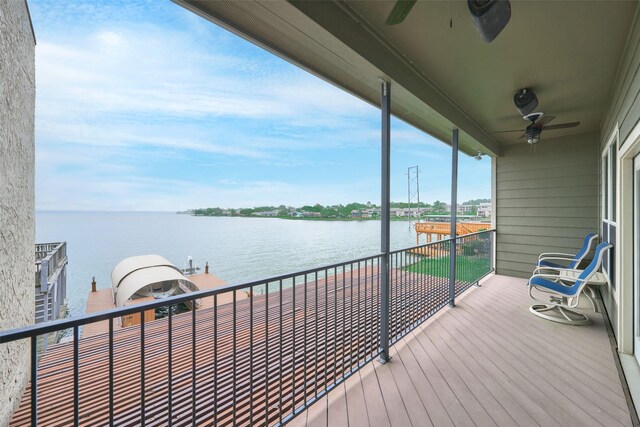 102 Capetown Slip, Conroe, TX 77356 - wooden deck with a ceiling fan and a water view