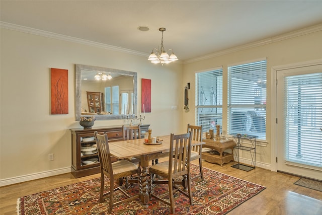 102 Capetown Slip, Conroe, TX 77356 - dining room featuring a chandelier, ornamental molding, wood finished floors, and baseboards