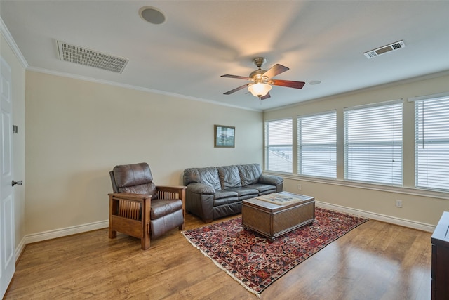 102 Capetown Slip, Conroe, TX 77356 - living room featuring ornamental molding, a ceiling fan, light wood finished floors, and baseboards